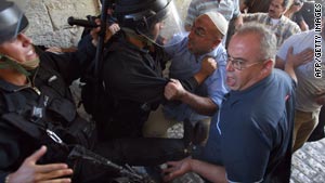 Israeli police scuffle with Palestinian men in Jerusalem's old city.