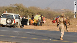 Saudi soldiers surround suspected Yemeni infiltrators near the Yemen border on November 7.