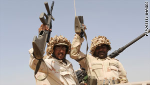 Saudi soldiers head toward the border with Yemen on Monday.