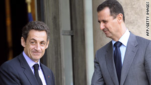Syrian President Bashar al-Assad (right) shakes hands with French President Nicolas Sarkozy at the Elysee palace.