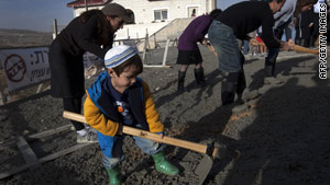 Israeli settlers pour a foundation in Efrat, West Bank, during a protest Wednesday.