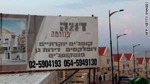A billboard promotes a new housing project in the West Bank settlement of Ma'ale Adumin.