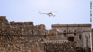 A security helicopter flies over Sanaa during an operation in December.