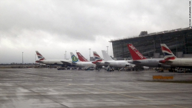 Tail fins of leased planes line up at Heathrow's Terminal 5, where BA's livery is normally the only colors on display.