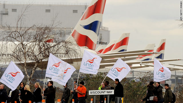 Striking BA cabin crew walk past grounded aircraft on the final day of a three-day strike near Heathrow airport.