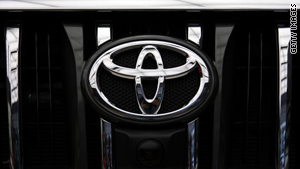 Toyota's logo is seen on the front grille of a car.