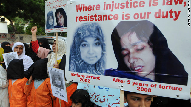 Pakistanis carry posters of Aafia Siddiqui in a demonstration in Karachi in 2008.