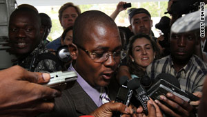 Edwin Coq, who represented 10 Americans detained in Haiti, speaks to reporters about the case last week.