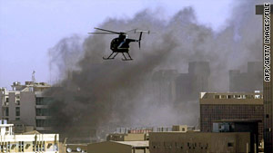 A Blackwater copter hovers over a Baghdad bomb site in 2005. The firm had 1,000 contractors in Iraq at one point.