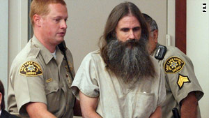 Brian David Mitchell is escorted into court in Salt Lake City, Utah, in July 2005.