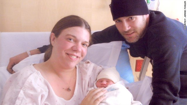 Lisa Cochran, left, and fiancé, Jerrid Fowler, pose with newborn Derrik in May 2009.