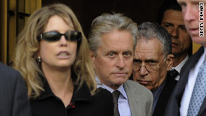 Michael Douglas and ex-wife Diandra Luker leave federal court in New York on Tuesday after their son's sentencing.
