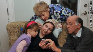 In this photo, with her parents and niece, Esti, Abbie Dorn seems aware of what is happening around her.