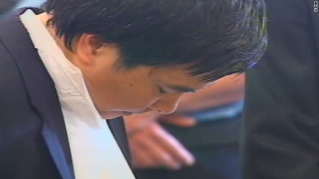 Lishan Wang hangs his head as the murder and attempted murder 
charges against him are read in a Connecticut courtroom.