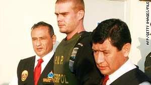 Joran van der Sloot, center, is escorted by police in Tacna, Peru, on June 4.