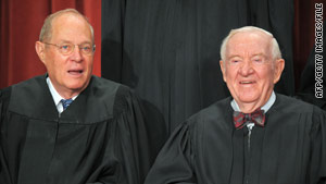 Justice John Paul Stevens, right, poses with Justice Anthony Kennedy in September.