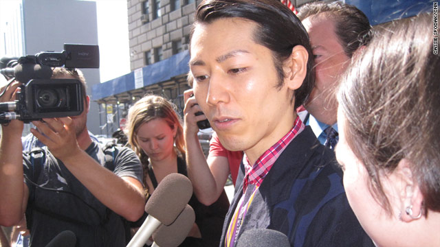 Competititive eating champion Takeru Kobayashi leaves a New York courthouse after a hearing Thursday.