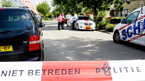 Police outside the residence in the Netherlands where the bodies of four babies were recovered.