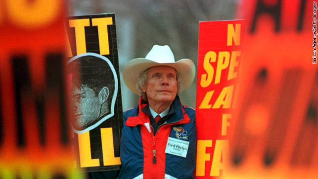 Church members, led by pastor Fred Phelps, believe God is punishing the United States for "the sin of homosexuality."