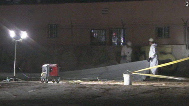 Workers inspect the scene in Southern California where a man was electrocuted.