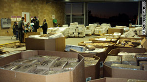 U.S. agents weigh marijuana seized from a tractor-trailer in San Diego, California, last Thursday.