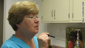 Nurse Barbara Kilgalen demonstrates an e-cigarette during research at Virginia Commonwealth University.