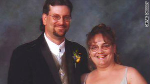 Chris Dolley and her husband, shown at a sister-in-law's wedding in 2004.