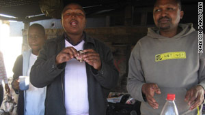 Dumile Klaas and Zandise Mtzang enjoy an afternoon snack in Gugulethu, near Cape Town.