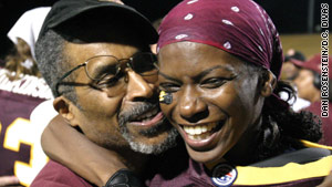 Natalie Randolph shares an embrace with her father, the late Nate Randolph, after a D.C. Divas game in 2006.