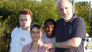 Bill Barry and Joan Jacobson pose with their two sons, Willie, left, and Alex, whom they adopted as newborns.