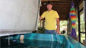 Vanderwyden shows his hot tub, which he fills with rainwater.