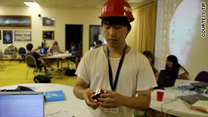 Dillon Dong takes a break from TIP's astronomy, physics and astrobiology class to show off his Rubik's Cube skills.