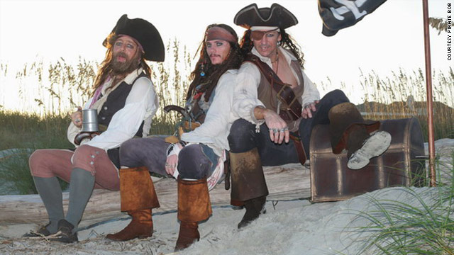 "Captain Jack Sparrow," center and "Pirate Bob," right, rest with a crewmate after finding some treasure at the Tybee Island Pirate Festival.
