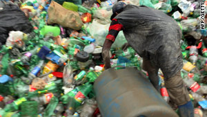 A man picks bottles for recycling at the Jardim Gramacho landfill site in Brazil.