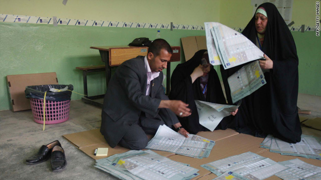 Iraqi election officials count votes Sunday at a polling station in the city of Karbala.
