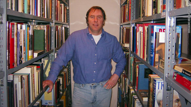 Rhode Island-based bookseller Mark Dalton poses with his stock of used books.