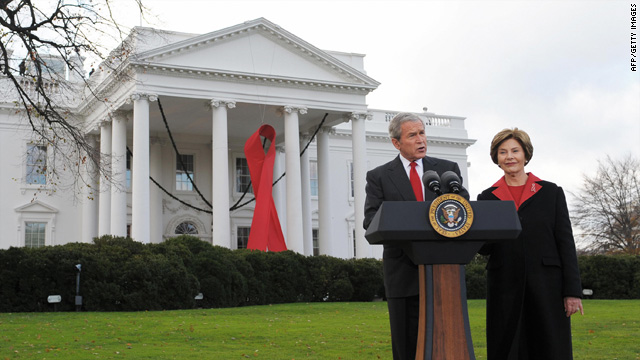 On World AIDS day in 2008, President George W. Bush makes a statement while First Lady Laura Bush looks on.