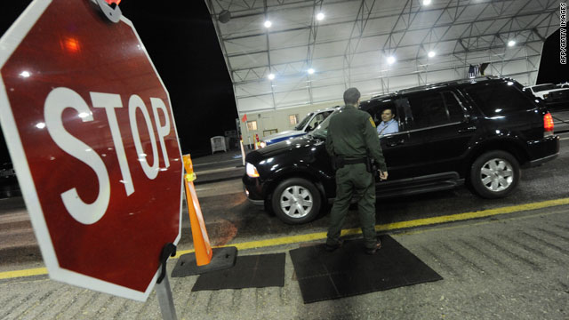 A U.S. Border Patrol agent checks vehicles arriving from Mexico near Nogales, Arizona, on July 28.