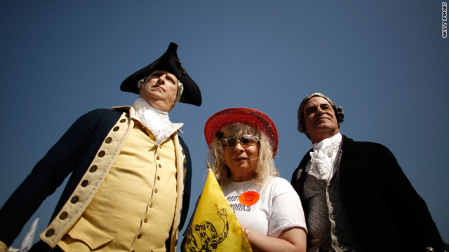 Historic re-enactors pose with Tea Party activist Nighta Davis of Georgia, during a pro-gun rally in Washington April 19.