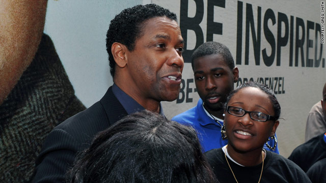 Denzel Washington shares a moment with some Boys and Girls Club members