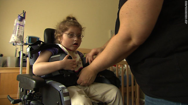 Karson Brewster, 4, suffers from a rare chromosomal defect. Her mother, Michelle, quit her job to take care of the child.