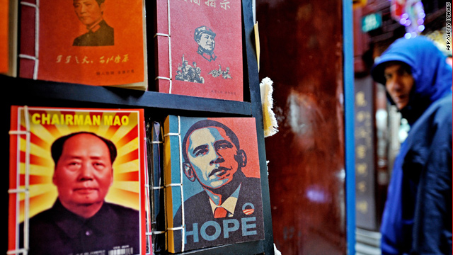 Portraits of late Chinese Communist leader Mao Zedong and President Obama are seen in Shanghai.