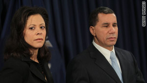 New York Gov. David Paterson, with his wife, Michelle, speaks to reporters on Friday.