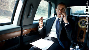 President Obama talks to a member of Congress on his way to a speech in Fairfax, Virginia, on Friday.
