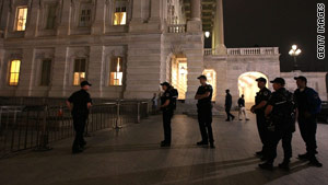 Capitol Police officers stand outside the Capitol Building Sunday evening before the vote on the health care reform bill.