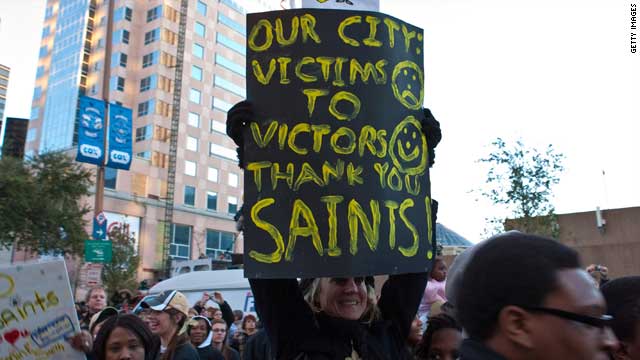 New Orleans residents, who had to flee the city in Katrina's aftermath, show their appreciation to Super Bowl winners Saints.