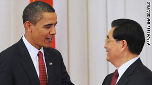 U.S. President Barack Obama chats to Chinese President Hu Jintao in Beijing in November.