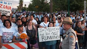 Demonstrators protest Arizona's new immigration law on Saturday in Phoenix.