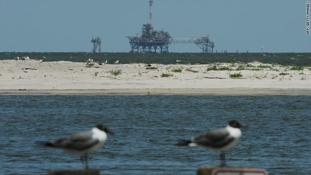 Seabirds sit in front of an offshore oil rig on Monday near Dauphin Island, Alabama, an area in the path of the Gulf oil spill.