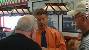 Republican Senate candidate Rand Paul talks to potential voters at a diner in Lexington, Kentucky.